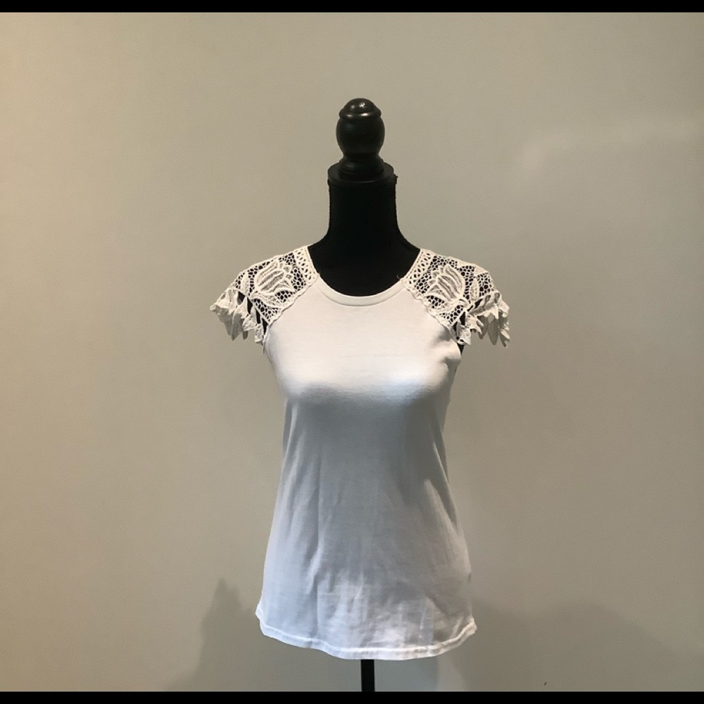 Soul Picked blouse with a decoration on the sleeve is in great condition.